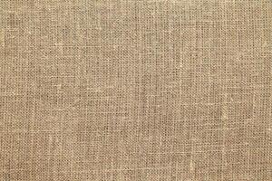 Natural linen material textile canvas Fabric texture background Close-up detail of fabric natural color Hemp material pattern design wallpaper. can be used as background or for graphic design photo