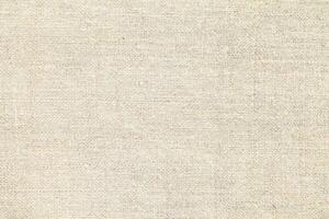 Natural linen material textile canvas Fabric texture background Close-up detail of fabric natural color Hemp material pattern design wallpaper. can be used as background or for graphic design photo