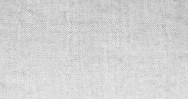 Natural linen material textile canvas Fabric texture background Close-up detail of fabric natural color Hemp material pattern design wallpaper. can be used as background or for graphic design photo