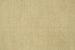 Natural linen material textile canvas Fabric texture background Close-up detail of fabric natural color Hemp material pattern design wallpaper. can be used as background or for graphic design photo