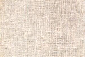 Natural linen material textile canvas Fabric texture background Close-up detail of fabric natural color Hemp material pattern design wallpaper. can be used as background or for graphic design photo