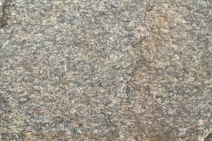 Abstract natural rock stone granite grunge rusty metal texture design background natural color stone material granite design wallpaper. Close-up detail of natural stone photo