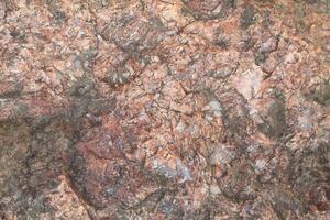 Abstract natural rock stone granite grunge rusty metal texture design background natural color stone material granite design wallpaper. Close-up detail of natural stone photo