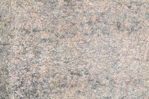 Abstract natural rock stone granite grunge rusty metal texture design background natural color stone material granite design wallpaper. Close-up detail of natural stone photo