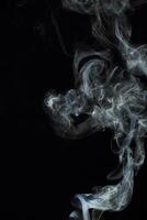 Abstract white smoke texture moves on black background Plume of smoke wave design wallpaper. Design element. Abstract texture photo