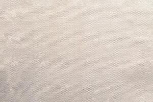 Natural linen material textile canvas Fabric texture background Close-up detail of fabric natural color Hemp material pattern design wallpaper. can be used as background or for graphic design photo