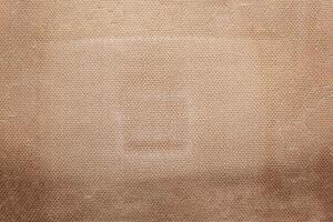 Natural linen material textile canvas Fabric texture background Close-up detail of fabric natural color Hemp material pattern design wallpaper. can be used as background or for graphic design photo