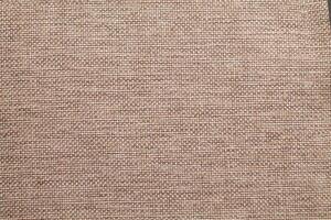 Natural linen material textile canvas Fabric texture background Close-up detail of fabric natural color Hemp material pattern design wallpaper. can be used as background or for graphic design photo