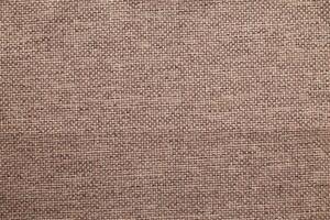 Natural linen material textile canvas Fabric texture background Close-up detail of fabric natural color Hemp material pattern design wallpaper. can be used as background or for graphic design photo