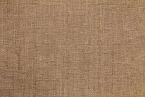 Natural linen material textile canvas Fabric texture background Close-up detail of fabric natural color Hemp material pattern design wallpaper. can be used as background or for graphic design photo