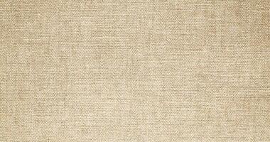 Natural linen material textile canvas Fabric texture background Close-up detail of fabric natural color Hemp material pattern design wallpaper. can be used as background or for graphic design photo