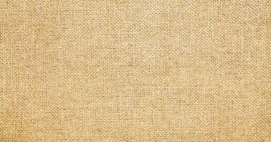 Natural linen material textile canvas Fabric texture background Close-up detail of fabric natural color Hemp material pattern design wallpaper. can be used as background or for graphic design photo