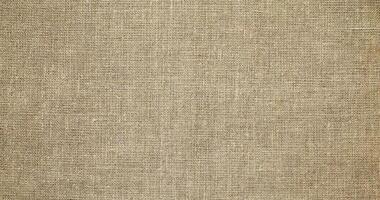 Natural linen material textile canvas Fabric texture background Close-up detail of fabric natural color Hemp material pattern design wallpaper. can be used as background or for graphic design photo