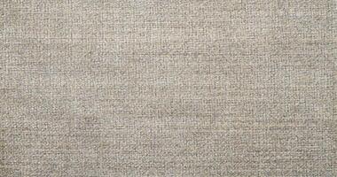 Natural linen material textile canvas Fabric texture background Close-up detail of fabric natural color Hemp material pattern design wallpaper. can be used as background or for graphic design photo