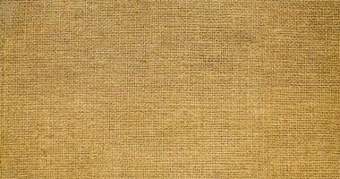 Natural linen material textile canvas Fabric texture background Close-up detail of fabric natural color Hemp material pattern design wallpaper. can be used as background or for graphic design photo