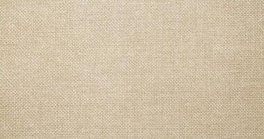 Natural linen material textile canvas Fabric texture background Close-up detail of fabric natural color Hemp material pattern design wallpaper. can be used as background or for graphic design photo