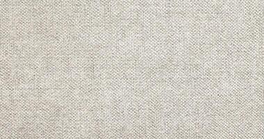 Natural linen material textile canvas Fabric texture background Close-up detail of fabric natural color Hemp material pattern design wallpaper. can be used as background or for graphic design photo