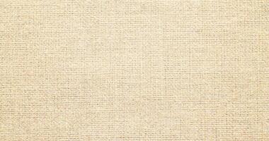 Natural linen material textile canvas Fabric texture background Close-up detail of fabric natural color Hemp material pattern design wallpaper. can be used as background or for graphic design photo