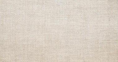 Natural linen material textile canvas Fabric texture background Close-up detail of fabric natural color Hemp material pattern design wallpaper. can be used as background or for graphic design photo