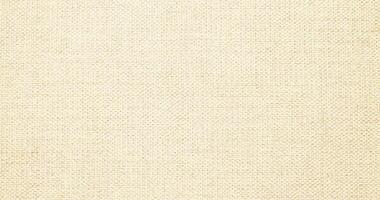 Natural linen material textile canvas Fabric texture background Close-up detail of fabric natural color Hemp material pattern design wallpaper. can be used as background or for graphic design photo