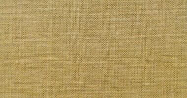 Natural linen material textile canvas Fabric texture background Close-up detail of fabric natural color Hemp material pattern design wallpaper. can be used as background or for graphic design photo