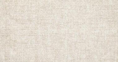 Natural linen material textile canvas Fabric texture background Close-up detail of fabric natural color Hemp material pattern design wallpaper. can be used as background or for graphic design photo