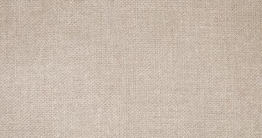 Natural linen material textile canvas Fabric texture background Close-up detail of fabric natural color Hemp material pattern design wallpaper. can be used as background or for graphic design photo