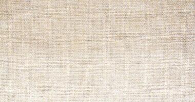Natural linen material textile canvas Fabric texture background Close-up detail of fabric natural color Hemp material pattern design wallpaper. can be used as background or for graphic design photo
