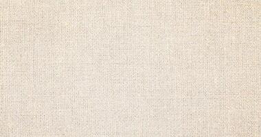 Natural linen material textile canvas Fabric texture background Close-up detail of fabric natural color Hemp material pattern design wallpaper. can be used as background or for graphic design photo