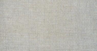 Natural linen material textile canvas Fabric texture background Close-up detail of fabric natural color Hemp material pattern design wallpaper. can be used as background or for graphic design photo