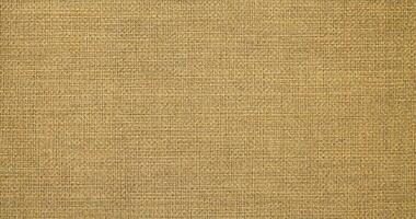 Natural linen material textile canvas Fabric texture background Close-up detail of fabric natural color Hemp material pattern design wallpaper. can be used as background or for graphic design photo