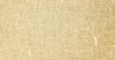 Natural linen material textile canvas Fabric texture background Close-up detail of fabric natural color Hemp material pattern design wallpaper. can be used as background or for graphic design photo