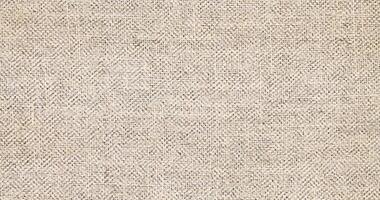 Natural linen material textile canvas Fabric texture background Close-up detail of fabric natural color Hemp material pattern design wallpaper. can be used as background or for graphic design photo