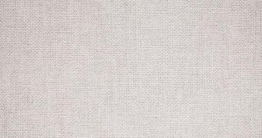 Natural linen material textile canvas Fabric texture background Close-up detail of fabric natural color Hemp material pattern design wallpaper. can be used as background or for graphic design photo