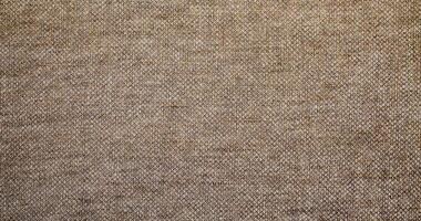 Natural linen material textile canvas Fabric texture background Close-up detail of fabric natural color Hemp material pattern design wallpaper. can be used as background or for graphic design photo