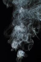 Abstract white smoke texture moves on black background Plume of smoke wave design wallpaper. Design element. Abstract texture photo
