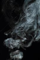 Abstract white smoke texture moves on black background Plume of smoke wave design wallpaper. Design element. Abstract texture photo