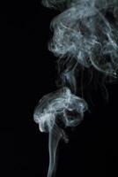 Abstract white smoke texture moves on black background Plume of smoke wave design wallpaper. Design element. Abstract texture photo