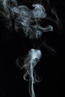 Abstract white smoke texture moves on black background Plume of smoke wave design wallpaper. Design element. Abstract texture photo