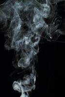 Abstract white smoke texture moves on black background Plume of smoke wave design wallpaper. Design element. Abstract texture photo