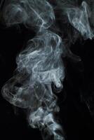 Abstract white smoke texture moves on black background Plume of smoke wave design wallpaper. Design element. Abstract texture photo