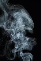 Abstract white smoke texture moves on black background Plume of smoke wave design wallpaper. Design element. Abstract texture photo