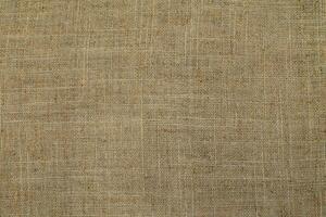 Natural linen material textile canvas Fabric texture background Close-up detail of fabric natural color Hemp material pattern design wallpaper. can be used as background or for graphic design photo