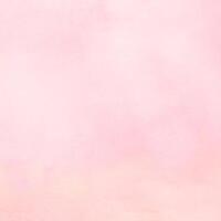 A pink and yellow watercolor background with a cloud photo