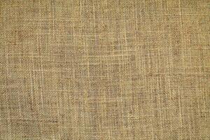 Natural linen material textile canvas Fabric texture background Close-up detail of fabric natural color Hemp material pattern design wallpaper. can be used as background or for graphic design photo