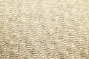 Natural linen material textile canvas Fabric texture background Close-up detail of fabric natural color Hemp material pattern design wallpaper. can be used as background or for graphic design photo