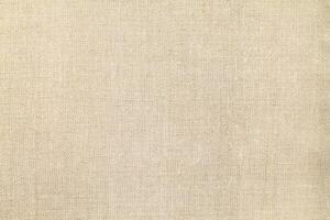 Natural linen material textile canvas Fabric texture background Close-up detail of fabric natural color Hemp material pattern design wallpaper. can be used as background or for graphic design photo