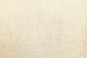 Natural linen material textile canvas Fabric texture background Close-up detail of fabric natural color Hemp material pattern design wallpaper. can be used as background or for graphic design photo
