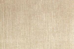 Natural linen material textile canvas Fabric texture background Close-up detail of fabric natural color Hemp material pattern design wallpaper. can be used as background or for graphic design photo
