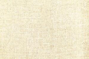 Natural linen material textile canvas Fabric texture background Close-up detail of fabric natural color Hemp material pattern design wallpaper. can be used as background or for graphic design photo